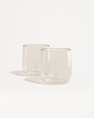 Signature Glasses: Two elegant borosilicate glasses set, perfect for enjoying beverages with a minimalist design.